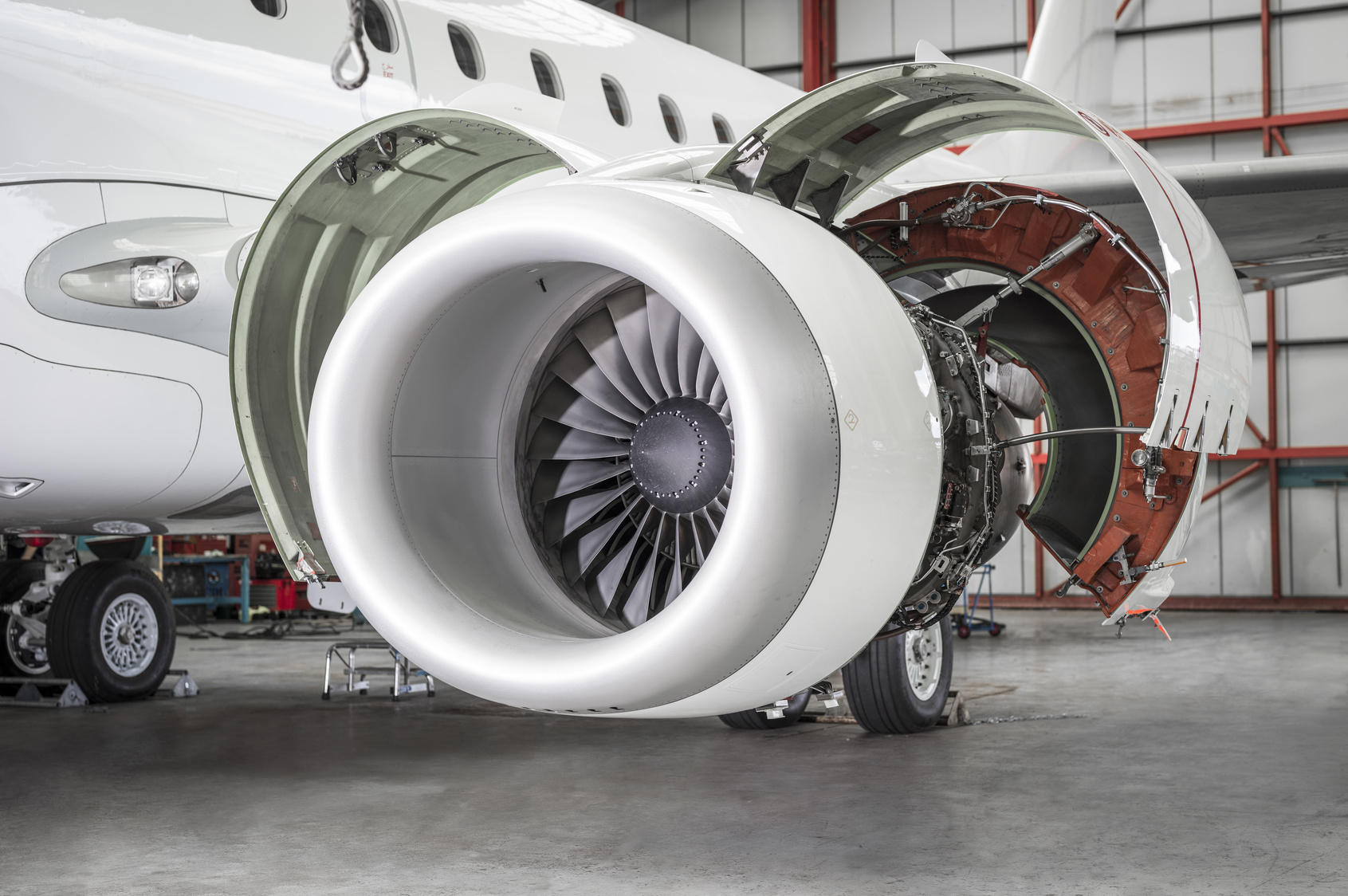 Open airplane engine in hangar